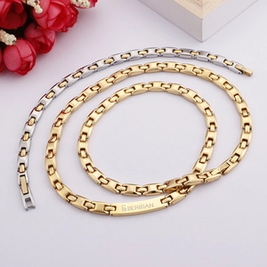 Titanium steel couple bracelet set in gold and silver finish with engraved rectangular plate
