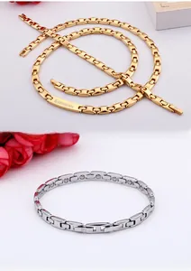 Detailed macro of gold and silver magnetic couple bracelets with engraved branding