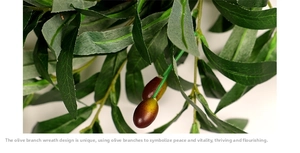 Close-up of realistic silk olive branch with detailed green leaves and purple berries