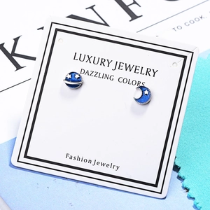 Blue planet and moon stud earrings featuring starry galaxy patterns in gold finish
