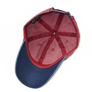 Internal view of a washed cotton baseball cap with two-tone stitching and metal buckle