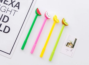 Close-up of fruit slice pens featuring watermelon, dragon fruit, lemon, and kiwi toppers
