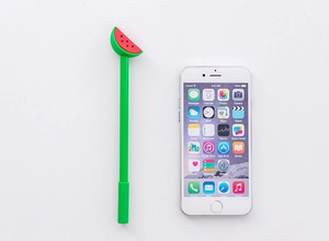 Close-up of creative watermelon slice design on top of a green gel ink pen