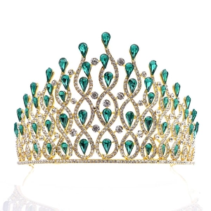 Luxurious gold bridal crown with emerald green teardrop gems and clear crystals