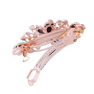 Rose gold crystal ponytail hair clip featuring multi-colored gemstones and spring clamp
