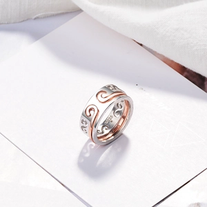 Silver and rose gold S925 silver rings with hollow wave design on white card