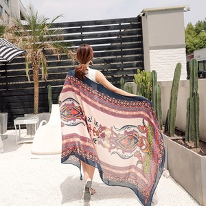 Detail of bohemian cotton linen shawl featuring ethnic paisley and geometric patterns