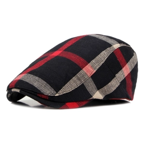 Classic British plaid beret hat in red and black checked pattern, side view on white background