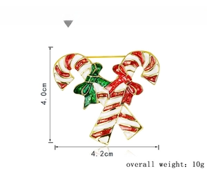 Detail view of enamel candy cane brooch with dimensions 4.0cm x 4.2cm and 10g weight