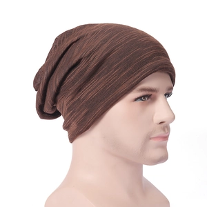 Detail view of dark brown knitted beanie with horizontal stripes on a mannequin head