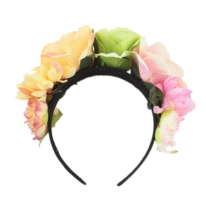 Detail of colorful artificial fabric roses on a black headband for wedding parties