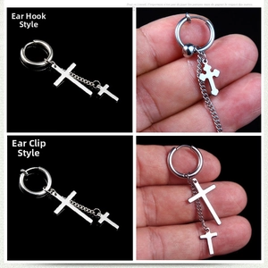 Detail of silver titanium steel cross pendant earrings with stylish double chain tassels