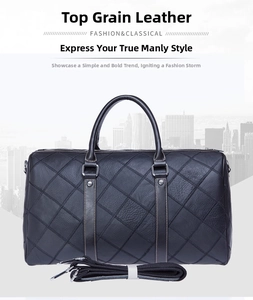 Macro detail of black leather travel bag featuring diamond quilted texture and sturdy handles