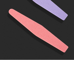 Macro view of purple and red high-elasticity nail sponges on a black background
