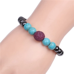 Detail of beaded bracelet with turquoise, black magnetite beads, and purple lava stone