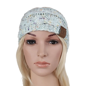 Close-up of light blue confetti knit headband with embossed C.C leather brand label