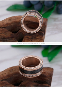 Macro detail of rose gold titanium ring with double rows of diamonds and carbon fiber inlay