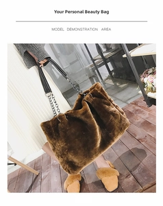 Brown faux fur tote bag with black leather shoulder strap and metallic chain detail