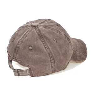 Detail view of washed cotton kids baseball cap with adjustable metal buckle strap
