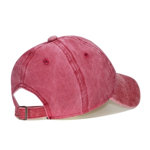Detail view of the vintage red washed cotton cap showing the metal buckle closure