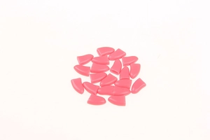 Detailed view of 20 bright pink silicone cat nail caps for scratch protection