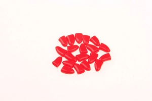 Detailed view of red soft silicone pet nail caps for cats and dogs with a smooth finish