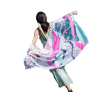 Ethnic style long cotton linen beach shawl with abstract floral print and vibrant pink and blue