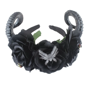 Detail of gothic black rose headband with ram horns and small insect decorations