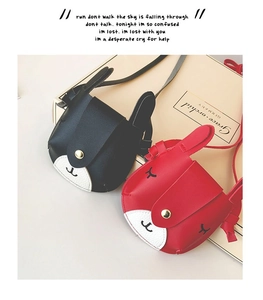 Close-up of cute rabbit-shaped mini shoulder bags for girls in black and red PU leather