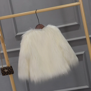 Detail view of white faux fur coat for girls featuring thick plush texture on a hanger