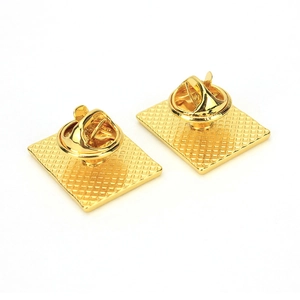 Detailed back view of square gold flag pins showing butterfly clutch and grid texture
