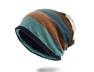 Detail of striped knitted beanie showing multi-color texture and dark blue lining