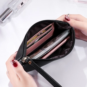 Minimalist black leather long wallet with pink compartments for phone and cards