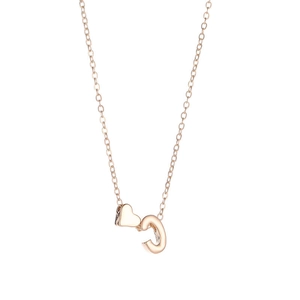 Detail of rose gold heart necklace with C-letter pendant on a clean white background