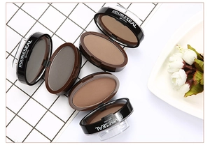 Close-up of five open double-color eyebrow powder compacts with applicator seals on a white tray
