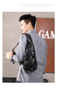 Men's black PU leather sling bag showing natural texture and multi-layer zippers on side