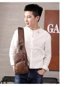 Brown PU leather chest bag with USB port worn by a model in a professional studio setting