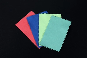 Macro shot of multi-colored microfiber cleaning cloths with zigzag edges for jewelry