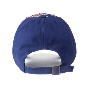 Navy blue baseball cap with flag pattern and silver studs featuring metal buckle adjustment