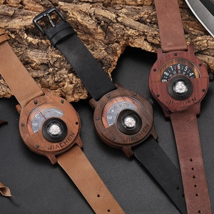Outdoor wooden watches with compass dials and leather straps on rustic wood background