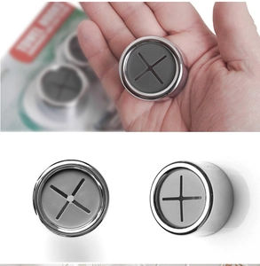 Detail of silver round push-in towel hook with gray silicone slot for wall mounting