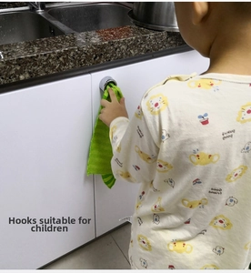 Adhesive silver round hook for kitchen cabinets showing towel storage and easy child use
