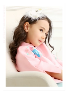 Detailed view of pink Chinese style kids hair clip with delicate feather and floral embroidery
