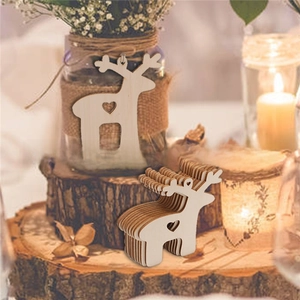 Detail of wooden reindeer ornaments with hollow heart designs and natural wood finish