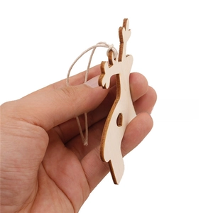 Macro detail of laser-cut wooden deer ornament showing thickness and natural wood texture