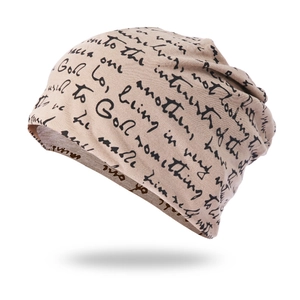 Detail of khaki slouchy beanie with black handwritten cursive text print pattern