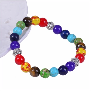 Macro shot of 8mm yoga beads bracelet featuring colorful natural stones and silver spacers