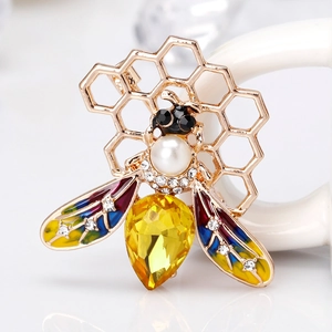 Fashionable bee and honeycomb brooch in gold alloy with yellow gem and colorful wings