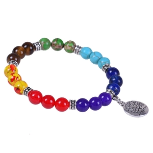 Chakra natural stone bead bracelet with silver Tree of Life charm on white background