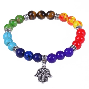 Chakra stone bracelet with colorful natural beads and silver Hamsa Hand charm on white background